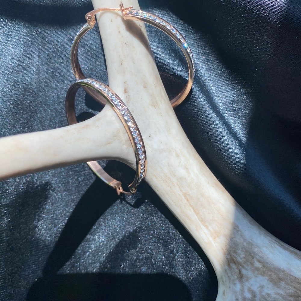 Stunning faux diamond hoop earrings in rose gold.